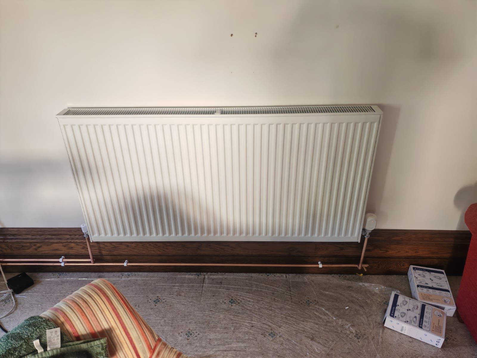 Full length radiator in the front room. Whole house air source heat pump by FB Gas, photo 18